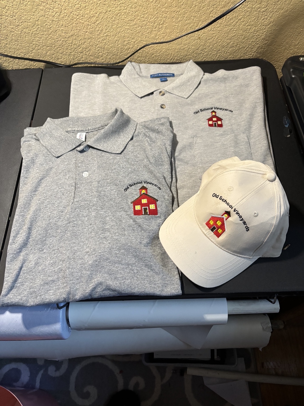 Custom embroidered black cap featuring a business logo